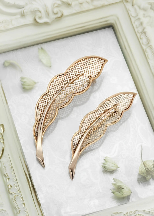 Van Cleef & Arpels, Pair of 18K Gold Feather Brooches VCA